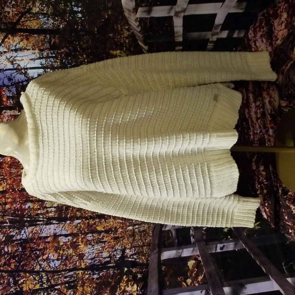 Girls DKNY White with silver sparkle, long sleeved soft sweater.